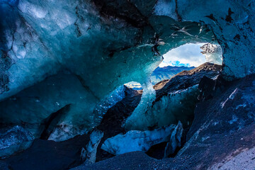 Inside an ice cave in Vatnajokull, Iceland. The ice is thousands of years old and so packed it is...