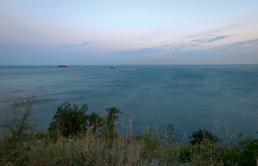 Pink sunset. Summer warm laziness.Panoramic view of the Black Sea. Russia. Blurred background.