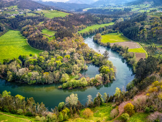 Naklejka na ściany i meble Aerial view of the meanders of the Navia river.