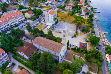 Montenegro. Adriatic Sea. Catholic Church on the shore of the Bay of Kotor. Summer. Drone. Aerial view