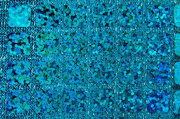 close up of the blue cyan sequins fabric texture bacckground