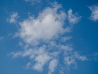 White clouds in the blue sky.