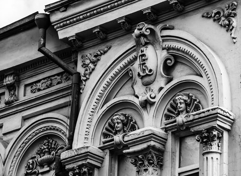 Cartouche on an old house. Aphrodite mascaron on the old facade