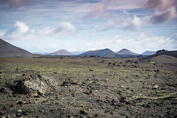 moonlike volcanic landscape with volcanos and mountains on lanzarote