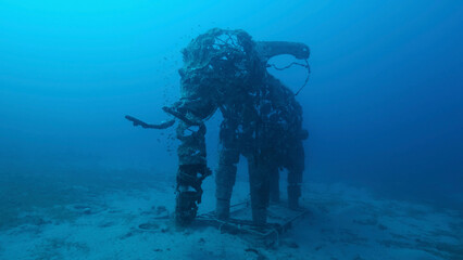 Fototapeta na wymiar Sculpture of an elephant on the seabed. Lighthouse dive site, Red Sea, Dahab, Egypt