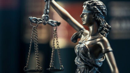 Legal and law concept statue of Lady Justice on books background