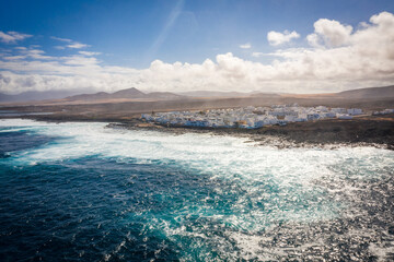aerial view on village located at ocean coast