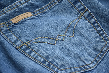 Fototapeta premium Lots of jeans pants in a stack. Denim background.