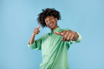 You're next. Joyful african american guy pointing fingers at camera and smiling, choosing you over...