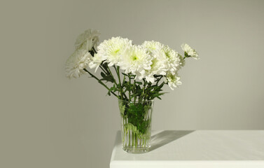 White chrysanthemums flower bouquet . Minimalist smoke still life. Nature horizontal copy space background.