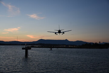 Naklejka na ściany i meble Aircraft approaching Corfu International Airport. Corfu island, Greece