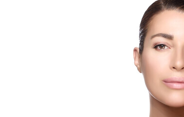 Fototapeta premium Beauty and Skincare Concept. Beautiful natural young woman face with nude makeup on a flawless skin