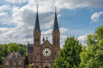 Fototapeta na wymiar Facade of Sint-Urbanuskerk church in Duivendrecht, on the southeast border of Amsterdam, built in 1878 in Neo-Romanesque style
