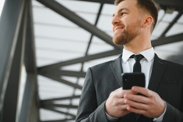 Portrait of a smiling businessman in a modern business environment