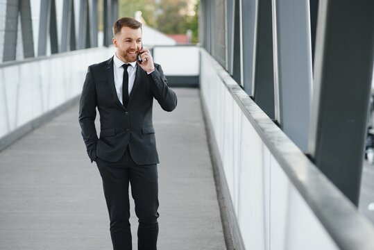 Handsome Male Model Posing Wearing A Back Suit.