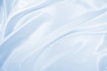 Smooth elegant blue silk or satin luxury cloth texture as abstract background. Luxurious background design