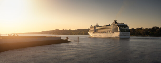 Large cruise ship leaves the port of Hamburg