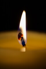 burning candle in the dark