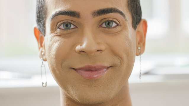 Portrait of smiling androgynous male looking to camera 
