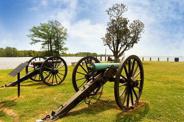 Two canons next to Penelope Barker House Welcome Center on a sunny day at Colonial Park, Edenton, North Carolina. 
