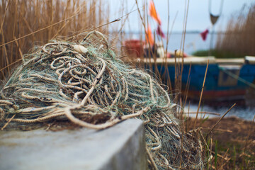 Rope at the shore near boat. High quality photo