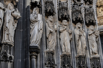 Details of Cologne cathedral (Cathedral Church of Saint Peter, from 1248). Cologne Cathedral - High Gothic five-aisled basilica, with a projecting transept and a tower facade. Cologne, Germany.