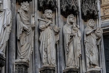 Details of Cologne cathedral (Cathedral Church of Saint Peter, from 1248). Cologne Cathedral - High Gothic five-aisled basilica, with a projecting transept and a tower facade. Cologne, Germany.