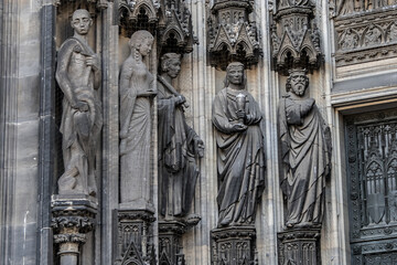 Details of Cologne cathedral (Cathedral Church of Saint Peter, from 1248). Cologne Cathedral - High Gothic five-aisled basilica, with a projecting transept and a tower facade. Cologne, Germany.