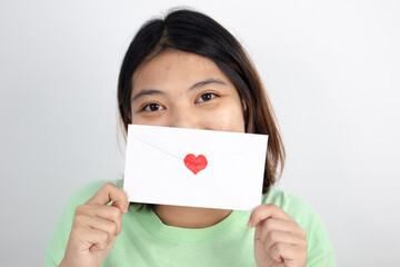 Asian girl with love letter Valentine's Day concept