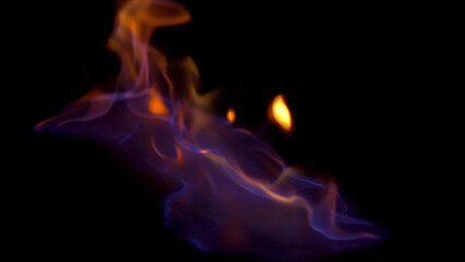 Close up horizontal view for blue and red burning fire, isolated on black background. Beautiful, hypnotic, mystical, red and blue flame.