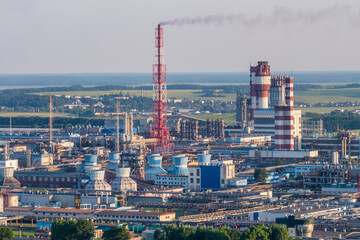 Naklejka premium aerial view on pipes of chemical enterprise plant. Air pollution concept. Industrial landscape environmental pollution waste of thermal power plant