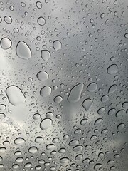 Raindrops on the top window (glass). Water drops on background.