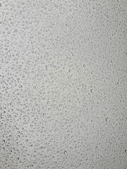 Raindrops on the top window (glass).
Water drops on background.