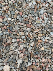 Small stone texture for background. High quality photo.
Rocks on a walk by the water.