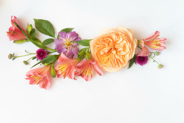 festive floral background art. floral layout from peach and orange and purple flowers on a white background isolated.