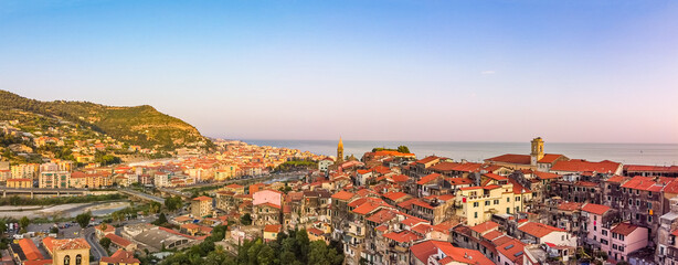 Obraz premium Aerial drone shot of old and new town, city of Ventimiglia, Liguria, Italy Beautiful panoramic aerial view from flying unmanned aerial vehicle of Ligurian Riviera