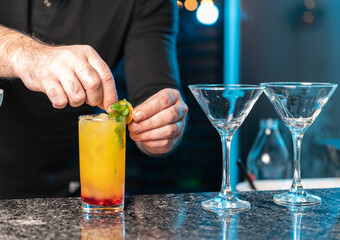bartender preparing passion fruit mojito drink
