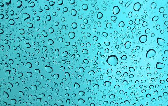 Raindrops on the top window (glass).
Water drops on background.