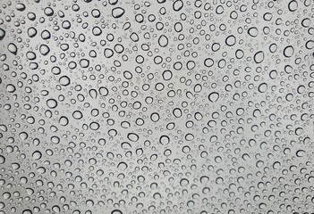 Raindrops on the top window (glass).
Water drops on background.