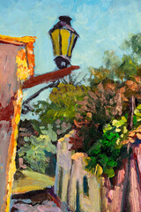 Close-up of vintage oil painting depicting an picturesque alleyway with a street light, stone houses and colorful plants and vegetation.