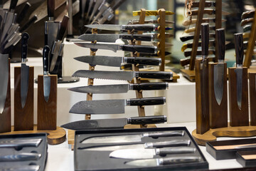 Damascus steel knives in showcase. Toledo knives collection in souvenir shop.