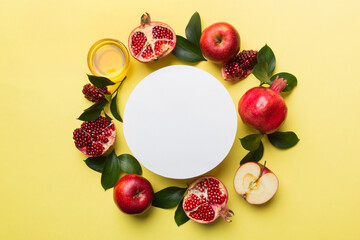 Flat lay composition with Blank flyer poster and symbols jewish Rosh Hashanah holiday attributes on colored background, New Year holiday Traditional. Top view with copy space mock up