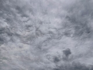 Cloudy sky with clouds. Low angle of bright blue sky with clouds