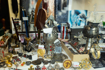 Variety of artisanal metal forged handicrafts on display at gift shop in Toledo. Concept of popular travel souvenirs.