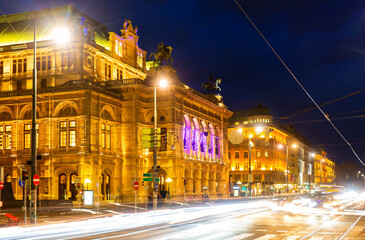 Fototapeta na wymiar Wide shot of traffic passing the Opernring and Vienna State Opera in Vienna, Austria