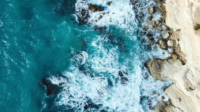Beautiful Aerial top view landscape, Pure blue ocean water waves crash mountain, Cyprus