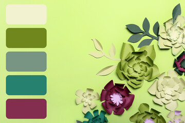 Beautiful handmade paper flowers on green background. Different color patterns