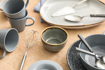 Set of dinnerware on beige table