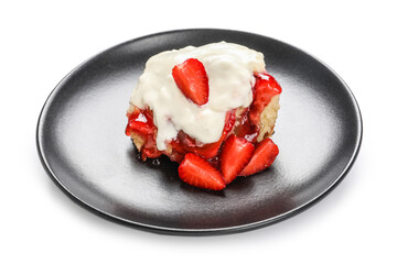 Black plate with strawberry cinnamon roll and cream on white background
