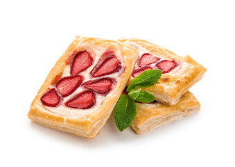 Strawberry puff pastries with mint leaves on white background